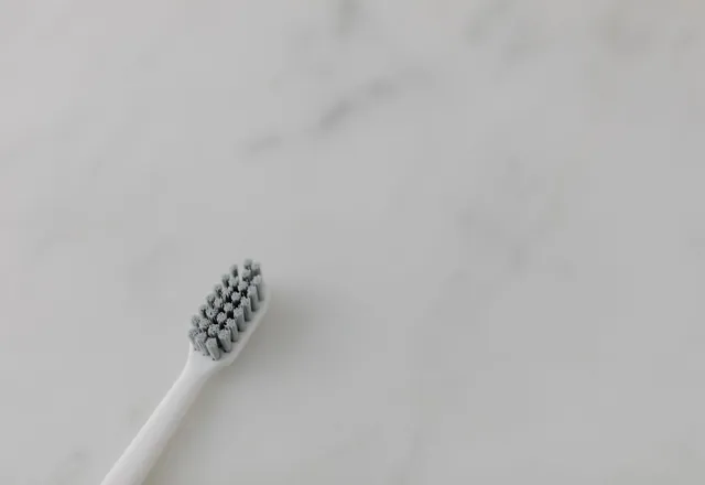 A toothbrush on a marble surface