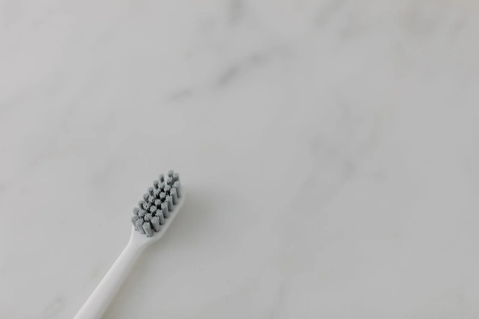 A toothbrush on a marble surface